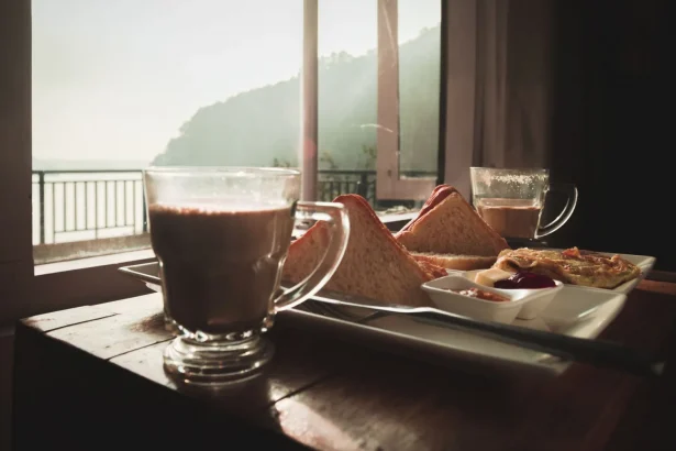 Warm breakfast with tea and toast by the window overlooking peaceful scenery in Nepal.