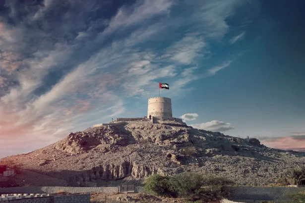 Majestic view of the Hatta Tower under a scenic sky, highlighting UAE's heritage.