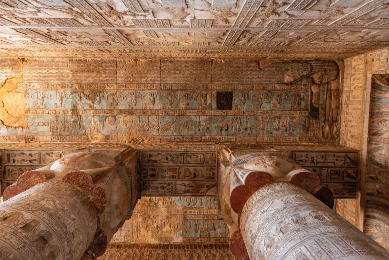 Explore the detailed hieroglyphs and grand columns of Dendera Temple, showcasing ancient Egyptian artistry.
