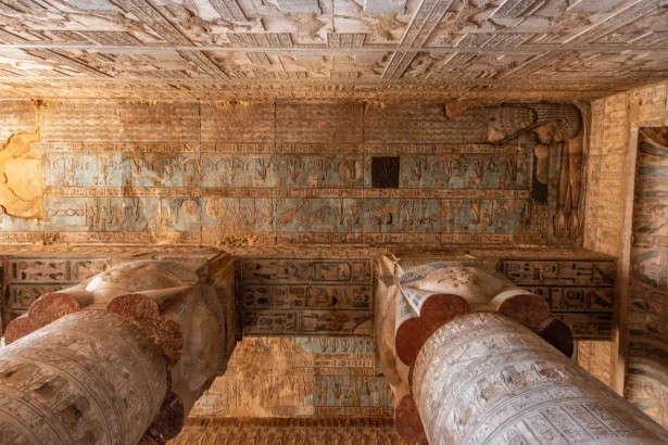 Explore the detailed hieroglyphs and grand columns of Dendera Temple, showcasing ancient Egyptian artistry.
