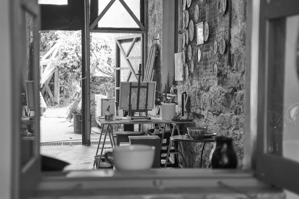 A detailed view of an artist's workshop with easels and paintings in Paphos, Cyprus.