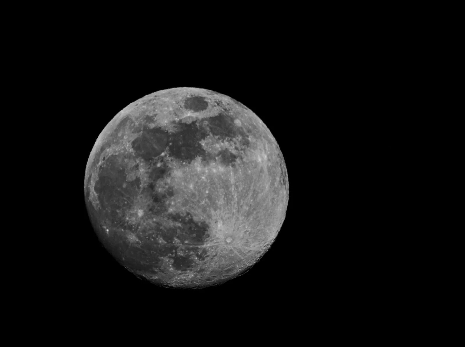 High-resolution image of a full moon against a dark night sky.