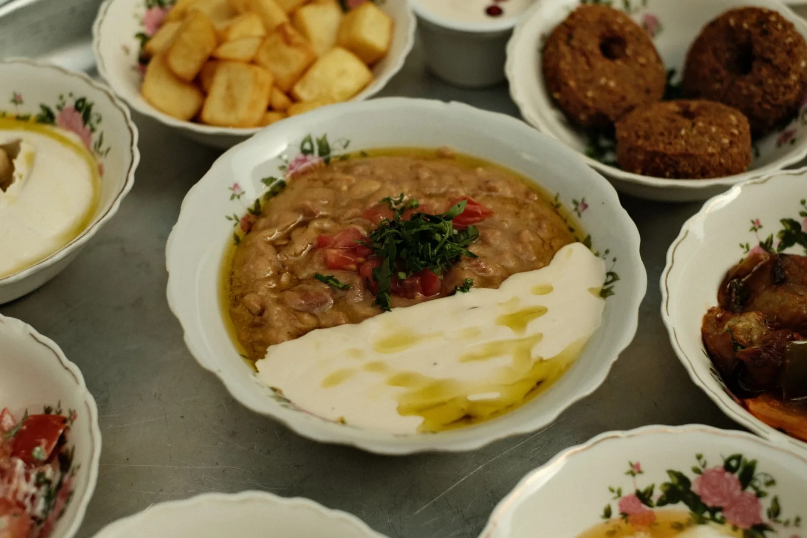 Explore an authentic Middle Eastern mezze platter with falafel, hummus, and more. Captured in Dubai.