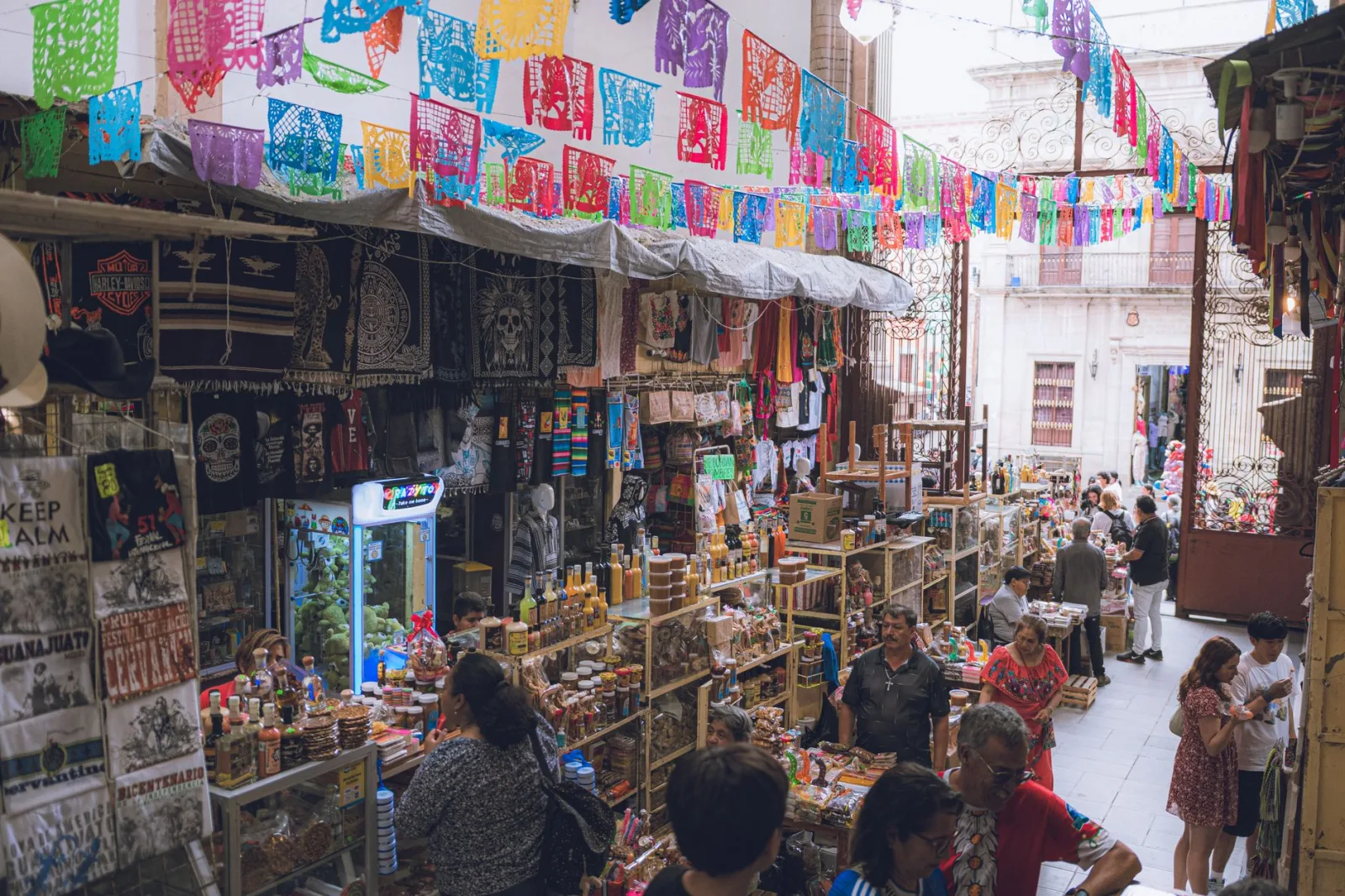 Colorful market scene in Guanajuato, showcasing traditional Mexican crafts and lively atmosphere.