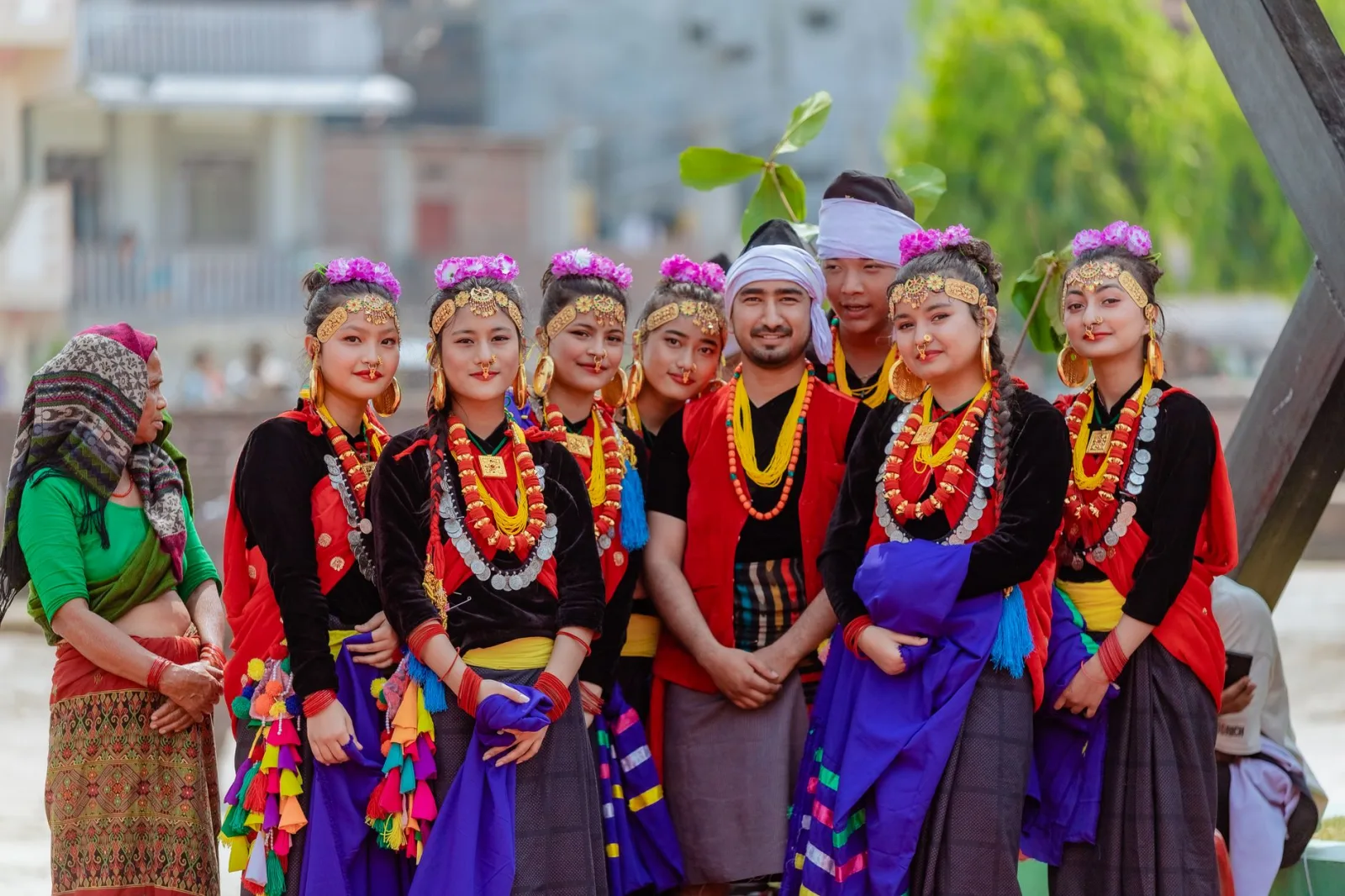 Colorful group in traditional Nepalese clothing enjoying a cultural event in Butwal, Nepal.